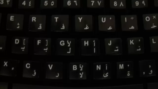 A keyboard with Arabic letters