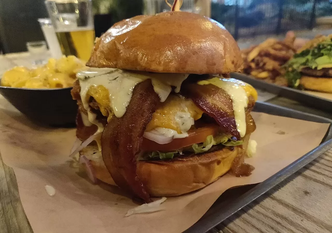 A cheeseburger served on a tray