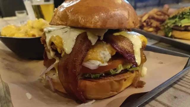 A cheeseburger served on a tray