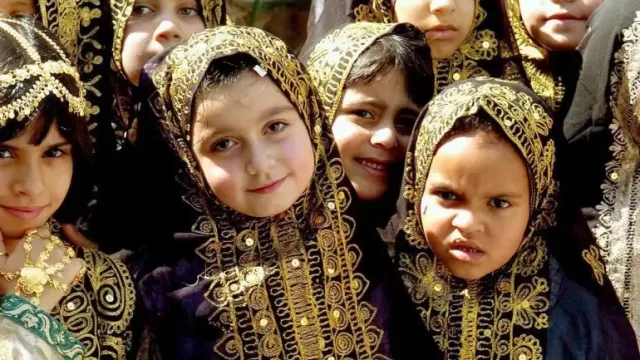 A traditional embroidered Kuwaiti gown and headscarf