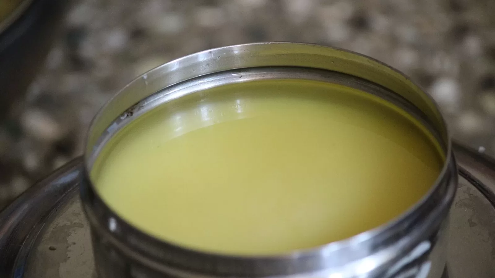 Clarified butter in a metal tin