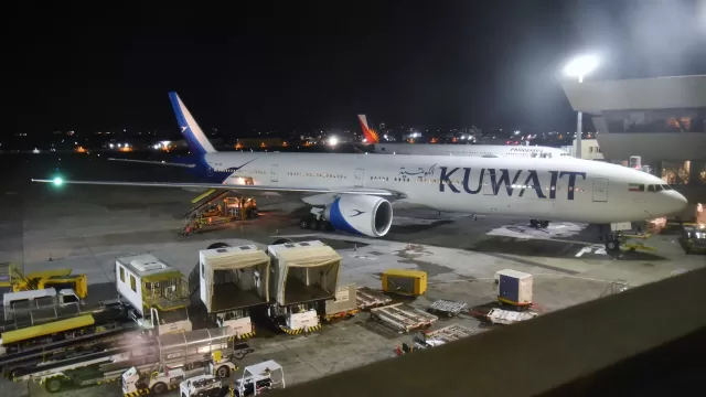 A Kuwait Airways aircraft at night