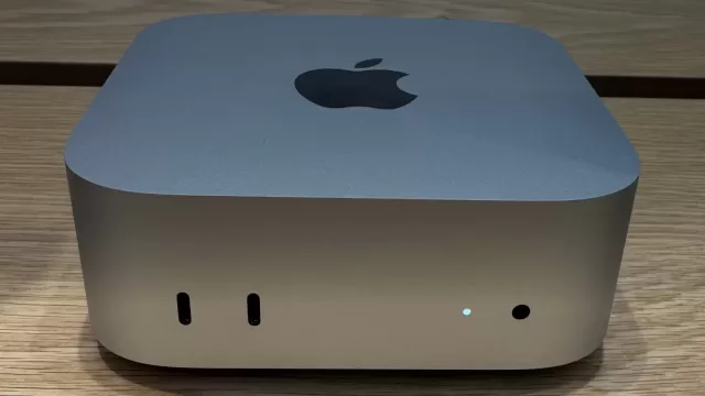 An Apple Mac mini desktop computer on a desk