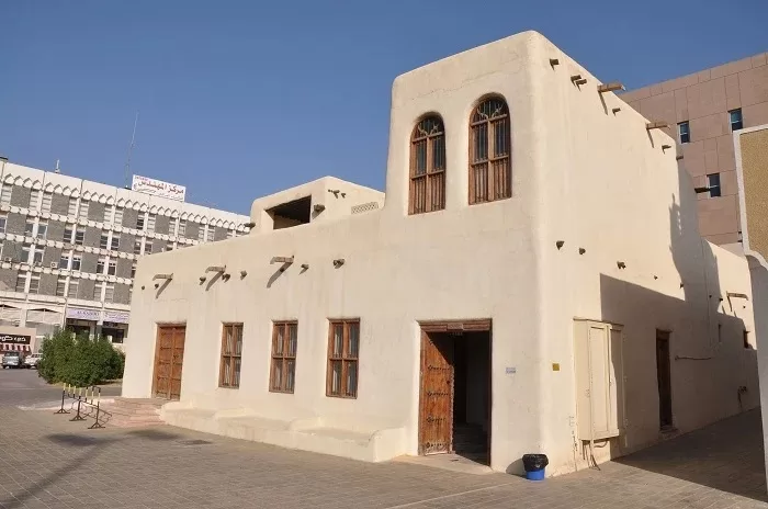 The mud-brick exterior of a traditional Kuwaiti house