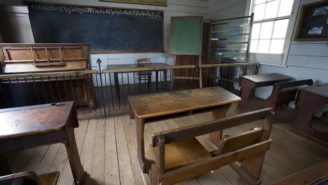 An old classroom fitted with wooden desks