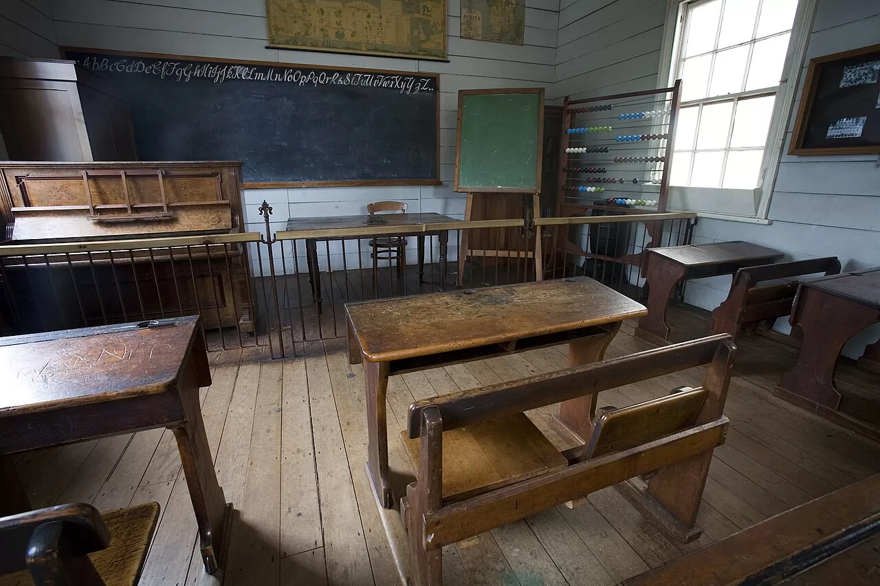 An old classroom fitted with wooden desks