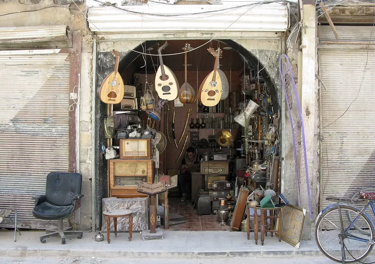Ouds hanging on the front of a musical instrument shop