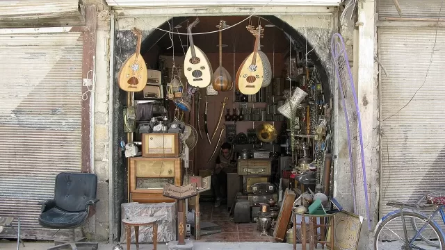 Ouds hanging on the front of a musical instrument shop