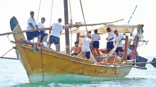 A traditional wooden pearling ship at sea