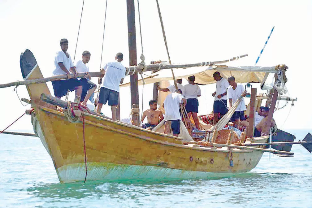 A traditional wooden pearling ship at sea