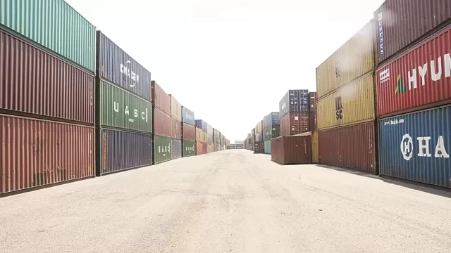 Cranes and berths at a Kuwaiti commercial port