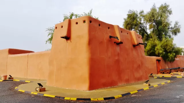 The exterior mud-brick walls of the Red Palace in Jahra, Kuwait