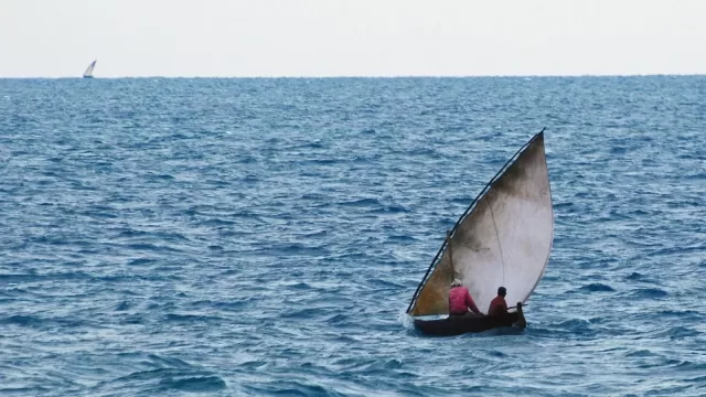 The sails of a traditional wooden sailing vessel