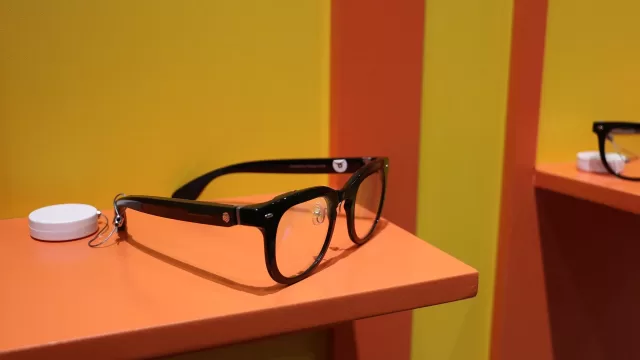 A pair of smart glasses displayed on a table