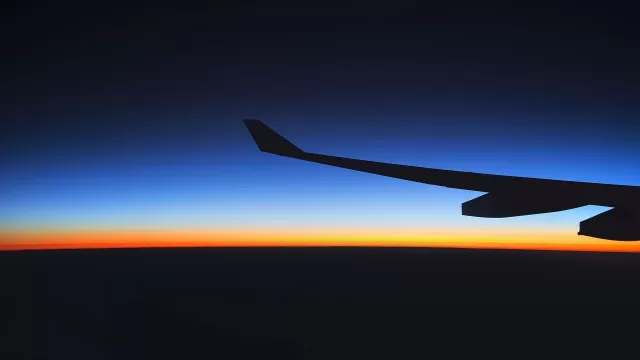 An aircraft wing at sunrise