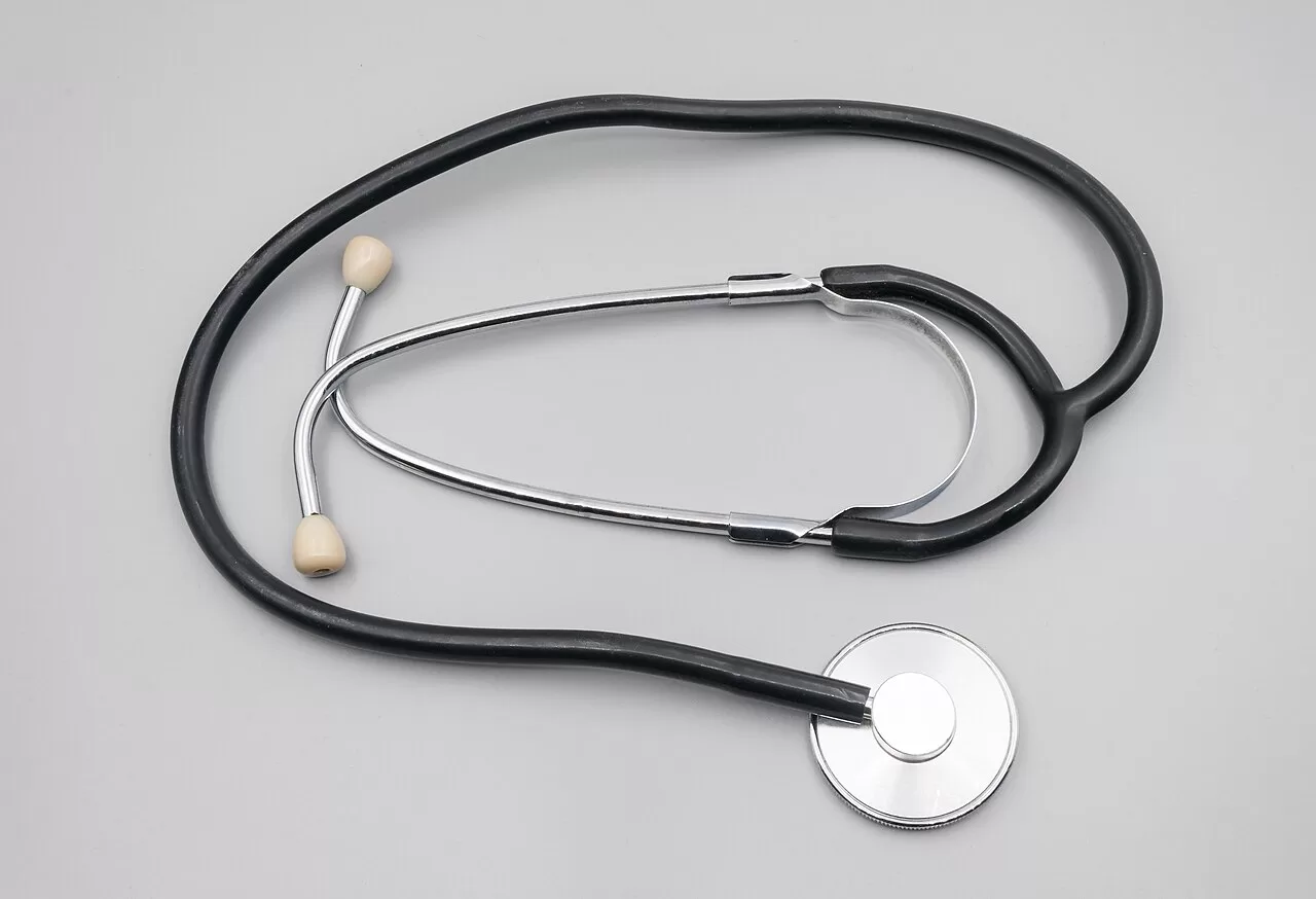 A doctor stethoscope on a plain surface