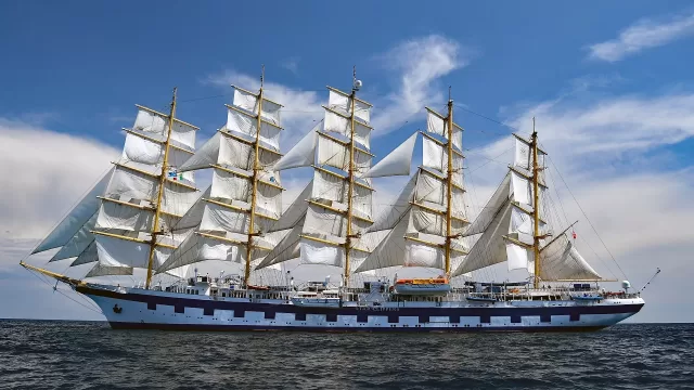 A tall sailing ship under sail at sea