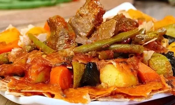 A dish of tashreeba, bread soaked in broth with meat and vegetables