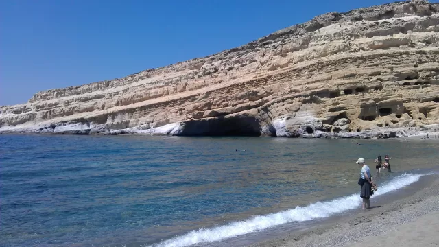 Tilted rock layers exposed in a cliff face