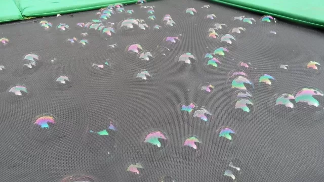Bubbles on the surface of a trampoline