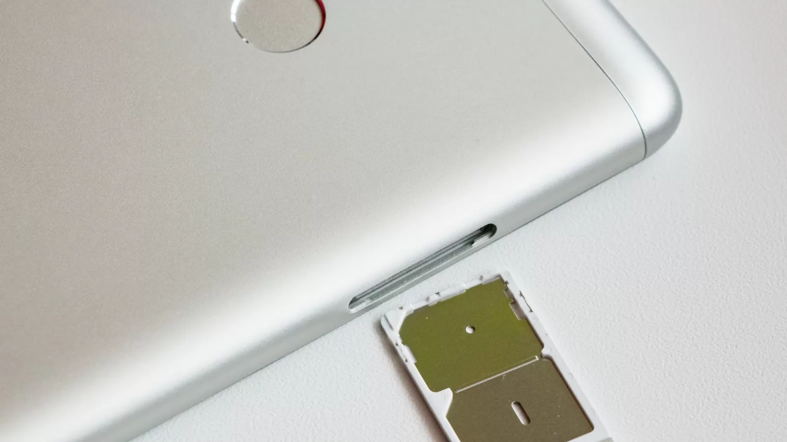 Smartphone with its SIM card tray pulled out