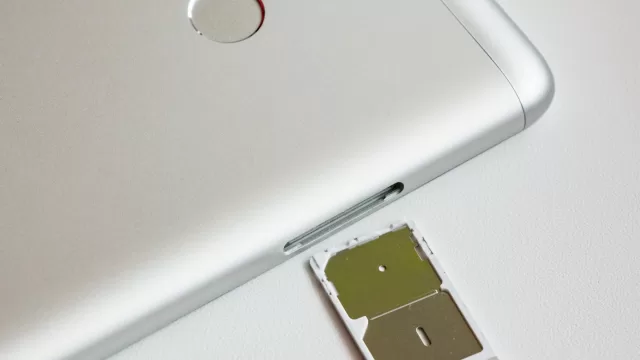 Smartphone with its SIM card tray pulled out
